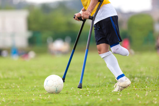 Amputee Soccer Player Kicking The Ball