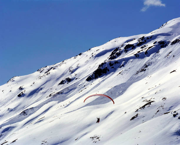 istock Flying with Paraski over the alp mountains in St Moritz Switzerland 879624716