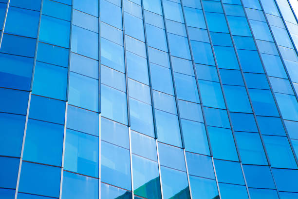 istock Modern architecture in blue tone,Windows on Skyscrapers,reflection on the glass 879631870
