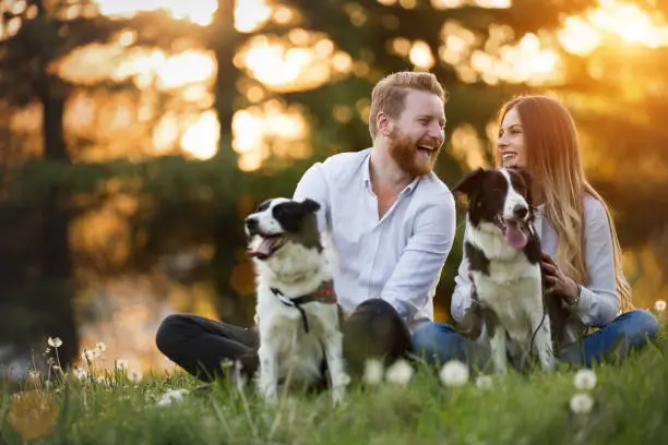 Photo of Romantic happy couple in love enjoying their time with pets