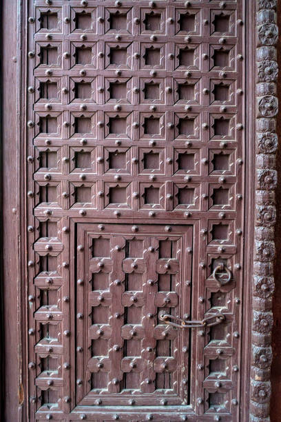 istock Old vintage red door in India 879645102