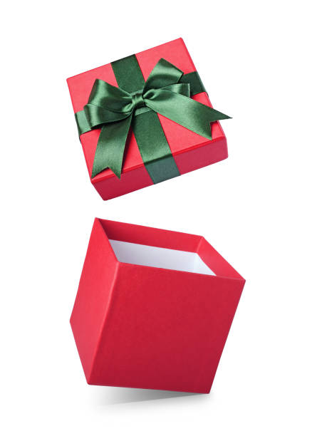 istock Classic red flying open gift box with green satin bow 879645648