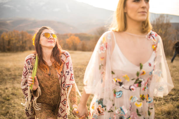 istock Two bohemian women enjoying outdoors in nature 879657146