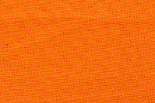 Close up of orange fabric texture for background. Top quality