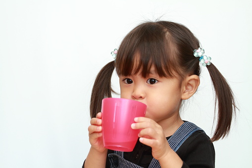 Japanese girl drinking water (3 years old)