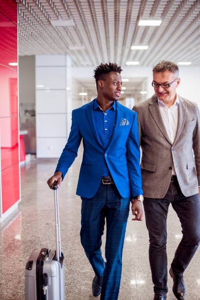 istock Two business colleagues in office lobby 879661866