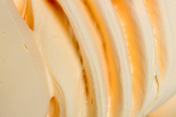 istock Close up of whipped orange cream 879667328