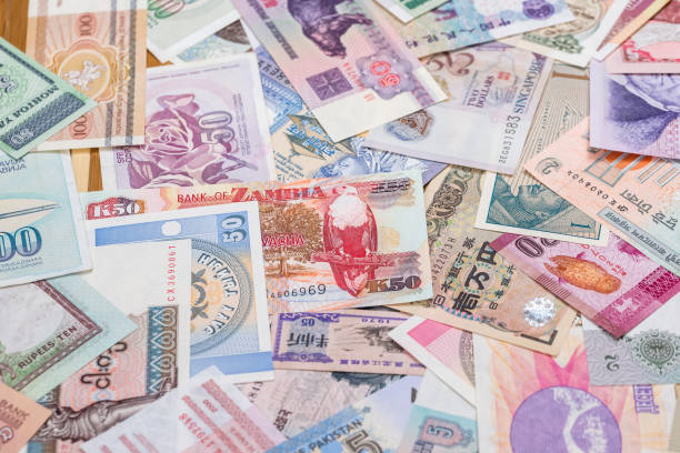 istock world paper money as background. close up 879667368