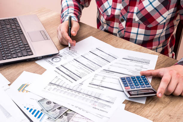 istock businessman making report, calculating or checking balance. 879669850