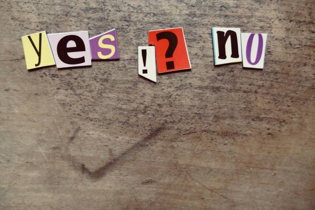 istock Words yes and no lying on wooden background 879669948
