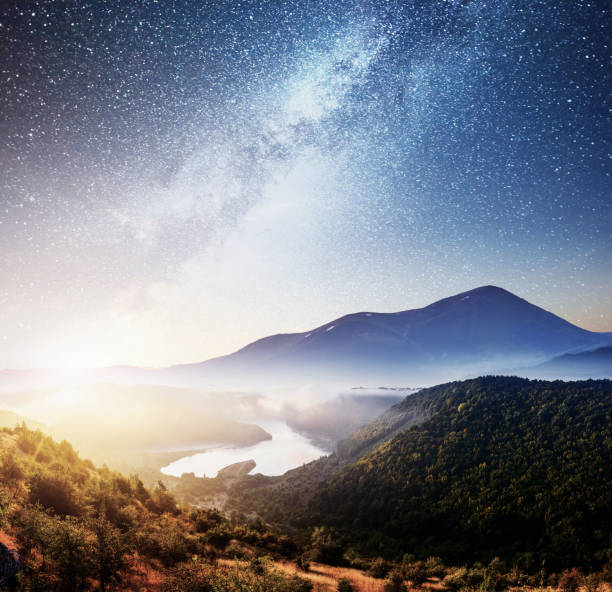 istock Mountain beautiful landscape with river views, vibrant night sky 879676922