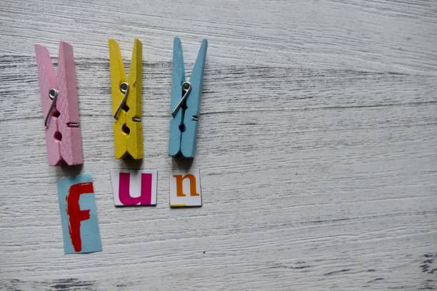 istock Word fun lying on white wooden background 879686574