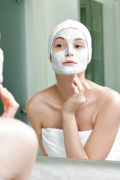 istock woman with a mask on her face 879695576