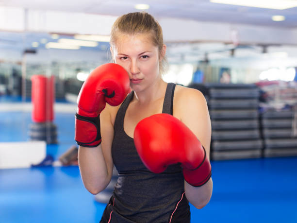 istock Woman boxing in gym 879695646