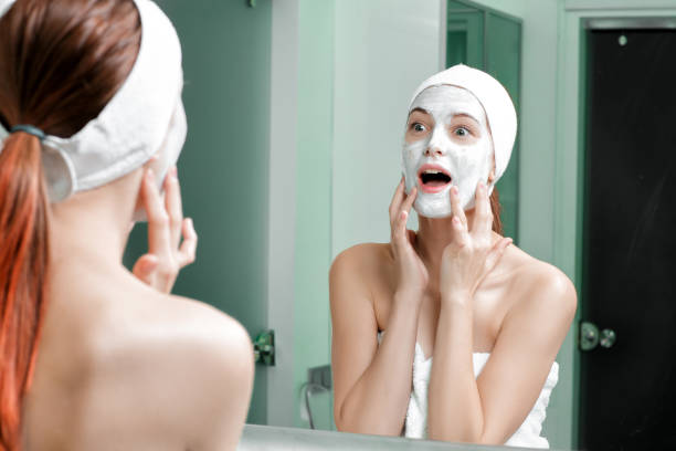 istock woman with a mask on her face 879696038