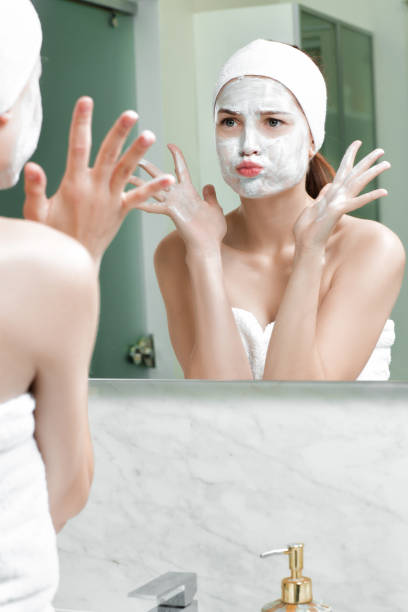 istock woman with a mask on her face 879696574