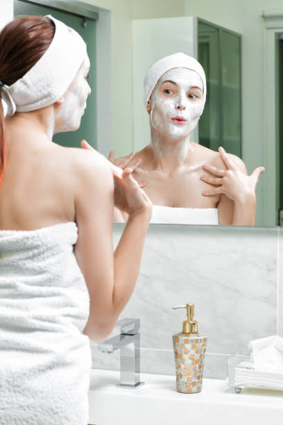 istock woman with a mask on her face 879696864
