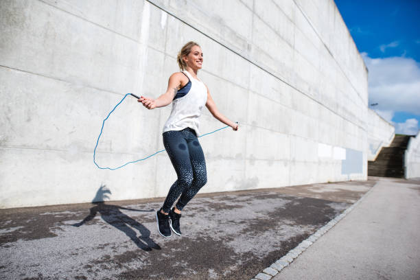 istock Woman jumping with a rope 879708748