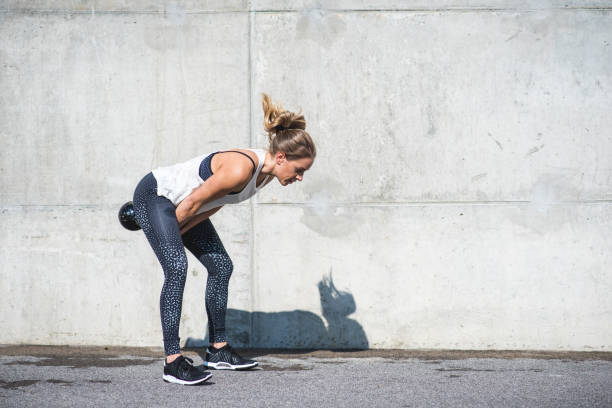 istock Woman doing kettlebell swings 879708796