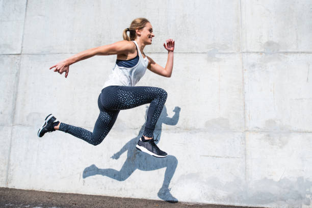 istock Woman running outdoors 879708814