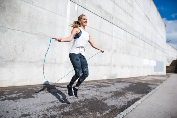 istock Woman jumping with a rope 879708816