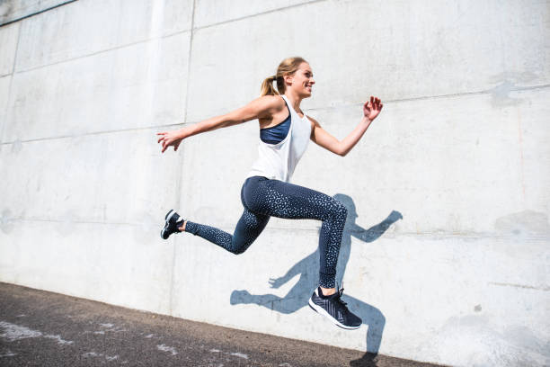 istock Woman running outdoors 879708832