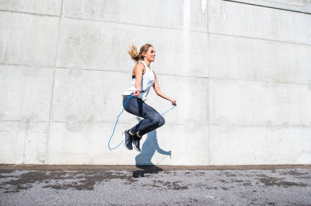 istock Woman jumping with a rope 879708880