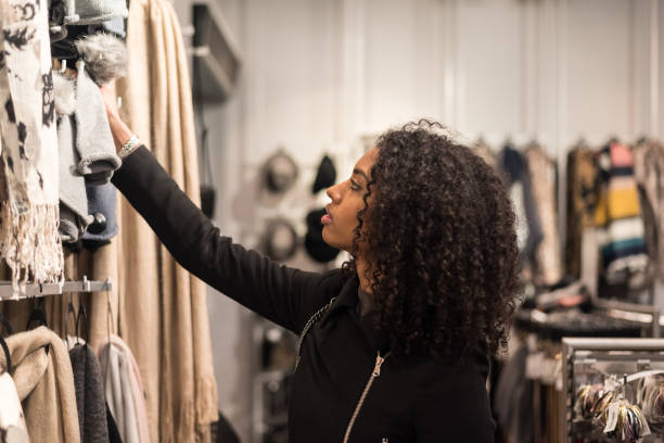 istock Black young woman doing shopping in a store 879714240
