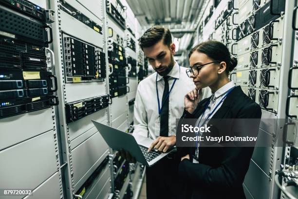 Handsome Man And Attractive Woman Are Working In Data Centre Stock Photo - Download Image Now