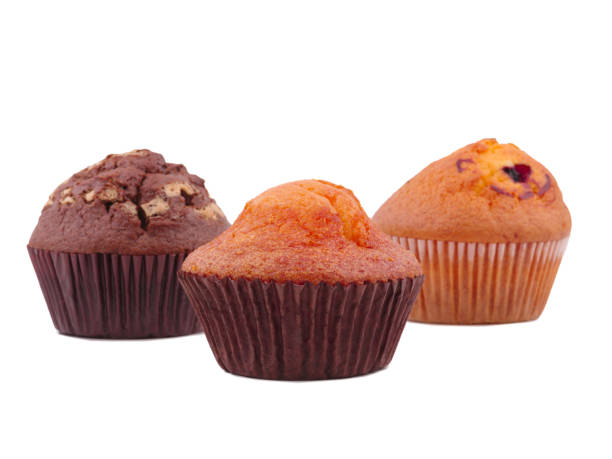 istock Three different cupcakes lie in the form of a triangle on a white isolated background 879723422