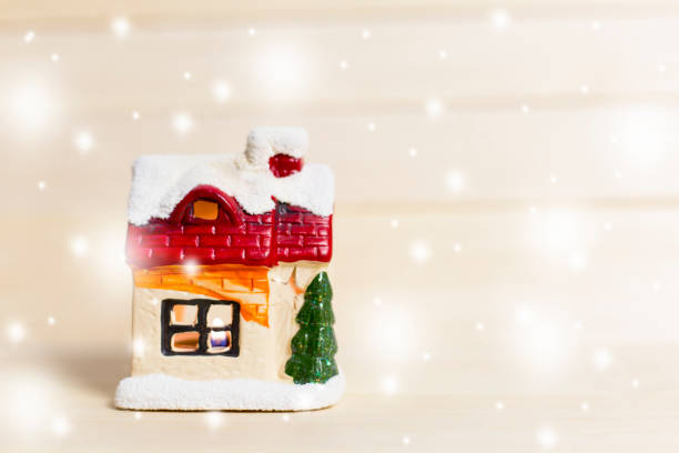 istock Christmas toy House with a candle 879725752
