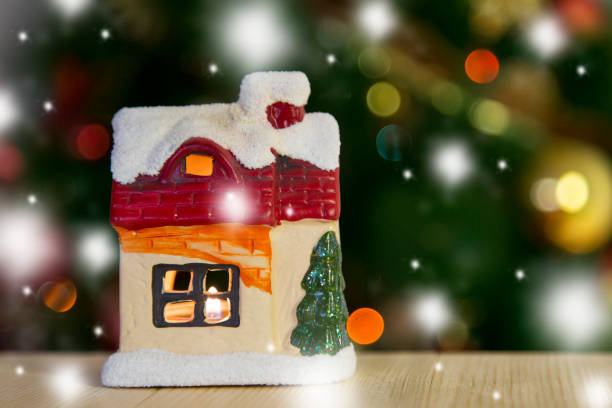 istock Christmas toy House with a candle 879726134