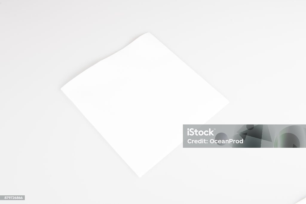 A one small disposable white napkin A white napkin for picnics or party meals Napkin Stock Photo