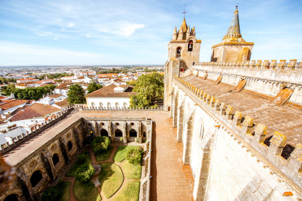 View on the terrace of the main cathedral with beautiful tower and courtyard in Evora city in Portugal