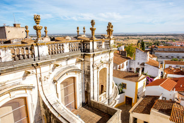 Cityscape view on the old town with the main cathedral building in Evora city, Portugal