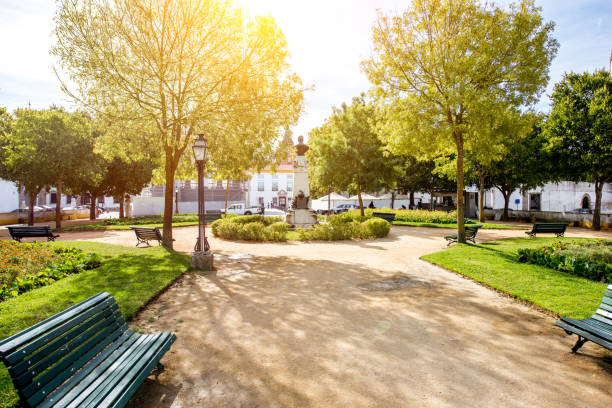 View on the Diana garden with Francisco Barahona statue in Evora old town in Portugal