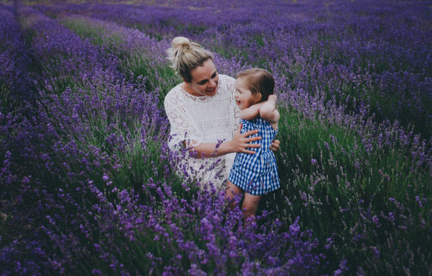 istock Mom and daughter in lavender. 879732922