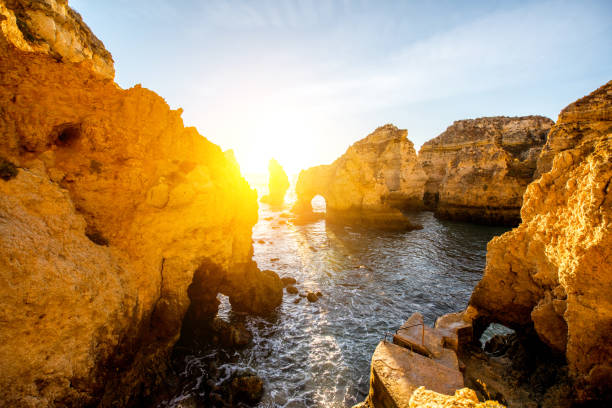 istock Rocky coastline in Lagos, Portugal 879736034