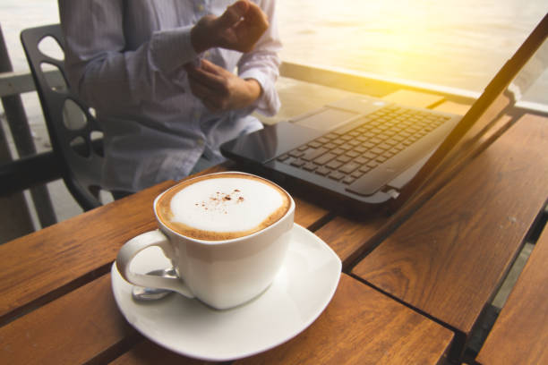 istock Women fold their sleeves to work in coffee shops. 879740804