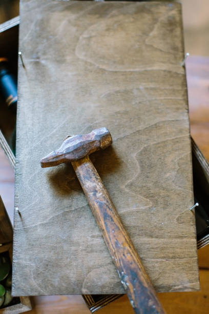 istock crafting, creativity, handmading concept. there is wooden box with small unclogged nails and big hammer for repairing and creating things 879751138