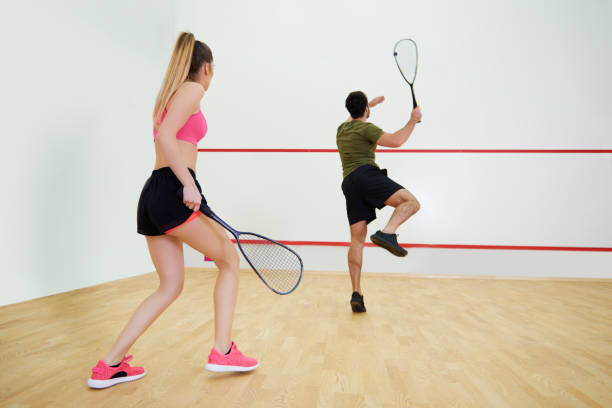 istock Rear view of couple during the squash game 879754182