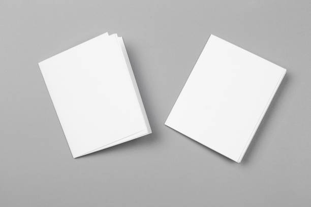 istock Blank portrait mock-up paper. brochure magazine isolated on gray, changeable background / white paper isolated on gray 879761184