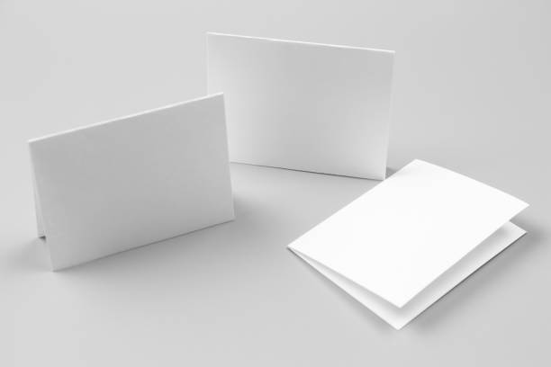 istock Blank portrait mock-up paper. brochure magazine isolated on gray, changeable background / white paper isolated on gray 879762424