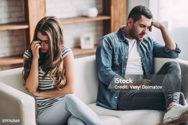 Upset Couple At Home Stock Photo - Download Image Now - Couple - Relationship, Sadness, Relationship Breakup
