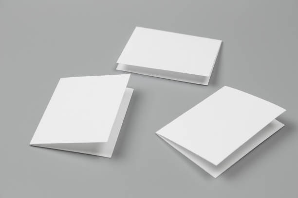 istock Blank portrait mock-up paper. brochure magazine isolated on gray, changeable background / white paper isolated on gray 879762892