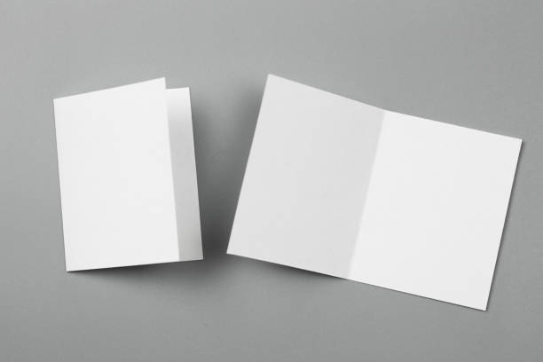 istock Blank portrait mock-up paper. brochure magazine isolated on gray, changeable background / white paper isolated on gray 879763538