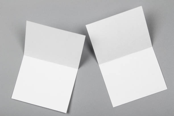 istock Blank portrait mock-up paper. brochure magazine isolated on gray, changeable background / white paper isolated on gray 879766082