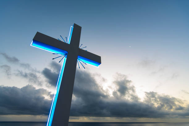 istock Neon cross on the sky background, cross against blue sky 879766656