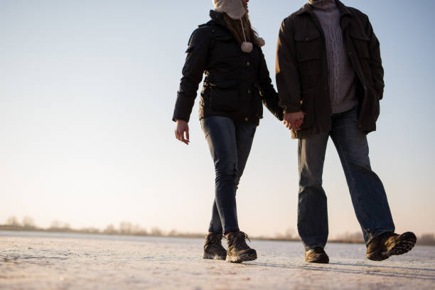 istock Couple taking a romantic walk on frozen lake 879769284