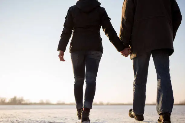 Rear shot of a romantic couple walking together